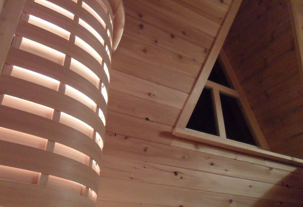 Inside custom sauna with cedar light fixture customized for every project.