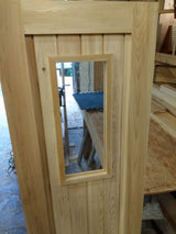 Cedar door with glass measuring 24" x 74"